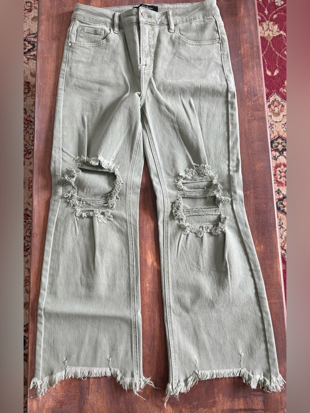 High-Rise Flared Distressed Jeans in Olive Green